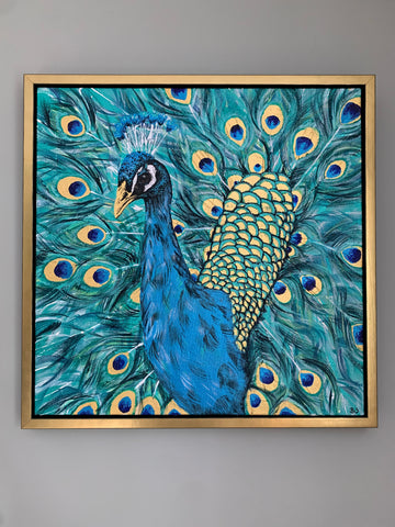 Iridescent acrylic painting of a peacock with gold leaf detailing on beak and feathers. Framed in a gold floater frame.
