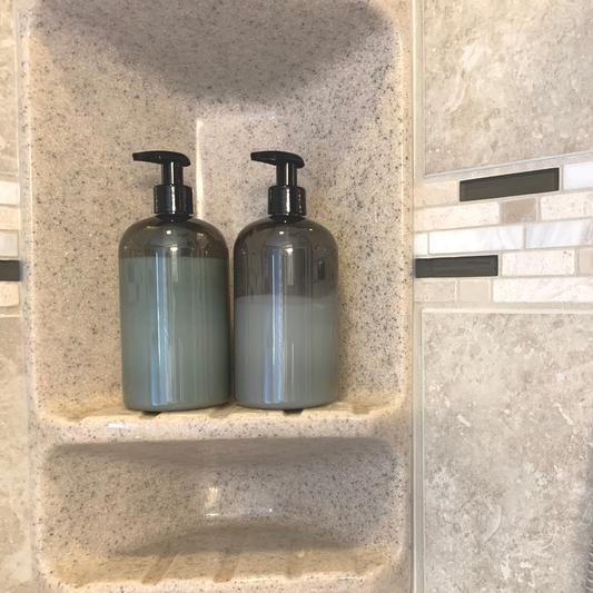 https://cdn.shopify.com/s/files/1/0699/0227/0772/products/Gray4Unprinted-2filledbottlesinshower.png?v=1687271977&width=533