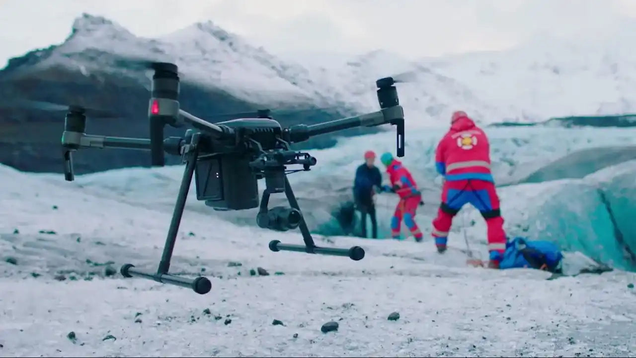 Drone being deployed in a search and rescue mission, equipped with cameras and lights for locating missing individuals.