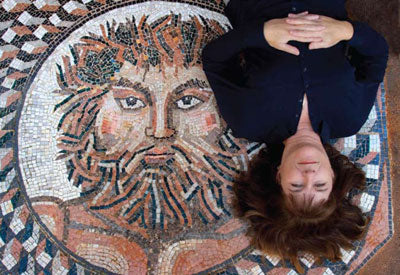 Anne reclines on Jupiter, mosaic entry art she made for a house designed by Dennis.
