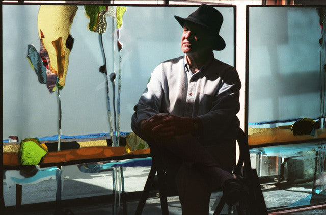 Anne Chadwick Williams, Sacramento Bee Staff Photo, to purchase photograph, visit sacbee.com/photos  Artist Greg Kondos poses in front of glass panels he designed for the expanded Sacramento International Airport at Architectural Glass Design in Napa where they were fabricated on Sept. 23, 1997.