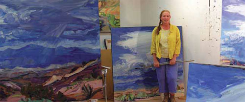 Louisa McElwain surrounded by clouds in her studio.