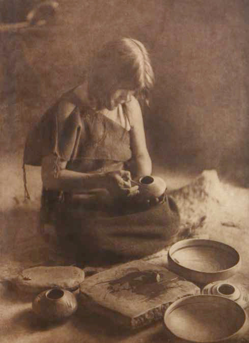 Edward S. Curtis (1868-1952), The Potter, plate 426, ca. 1906, photogravure on Japanese vellum, 173⁄4 x 13”. Photograph shows Nampeyo Old Lady of Hano.