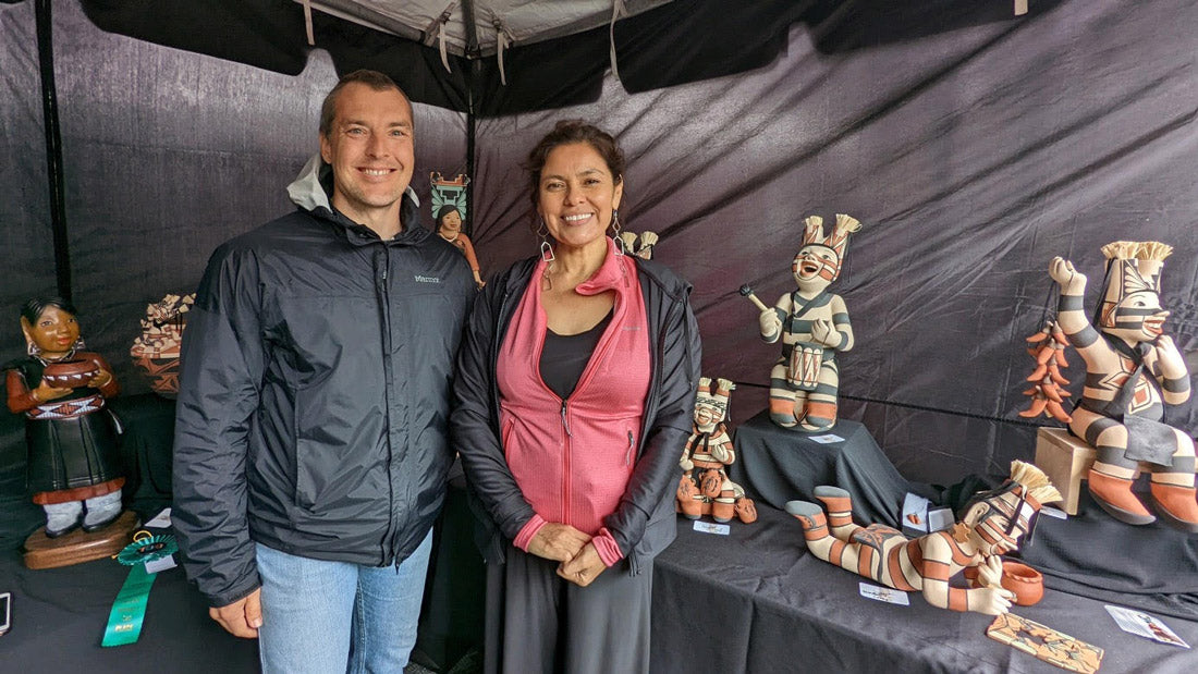 Writer Chadd Scott with Kathleen Wall, Jemez Pueblo, inside her SWAIA Indian Market booth 2022