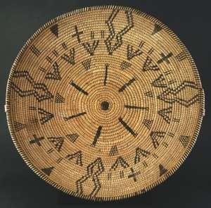 Apache pictorial tray, circa 1890-1900, 14 inches in diameter.