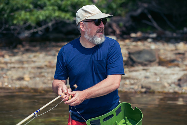 a man fishing in the ocean