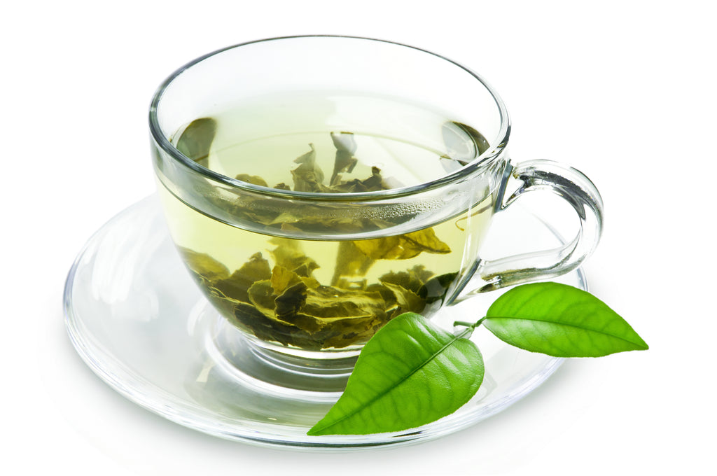 Green tea cup with tea leaves