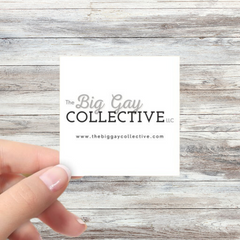 White square business card with black font on a grey wood background.