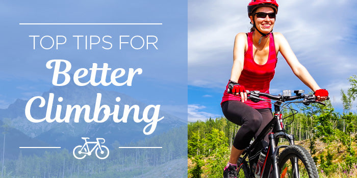 photo of woman climbing a hill on a bicycle, smiling, with dramatic mountain scenery in the background, overlay reads: top tips for better climbing.