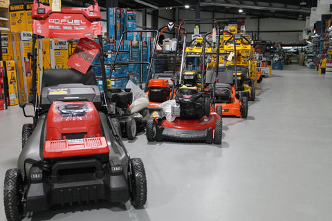 A lineup of push mowers at Bath Industrial Sales