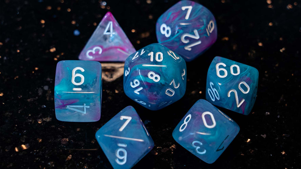 A classic RPG dice set (Nebula Water Lily/White Luminary from Chessex)