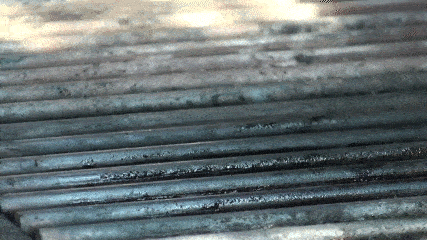 animated gif of how to use the BBQ Pic to scrape the dirty grill grates.