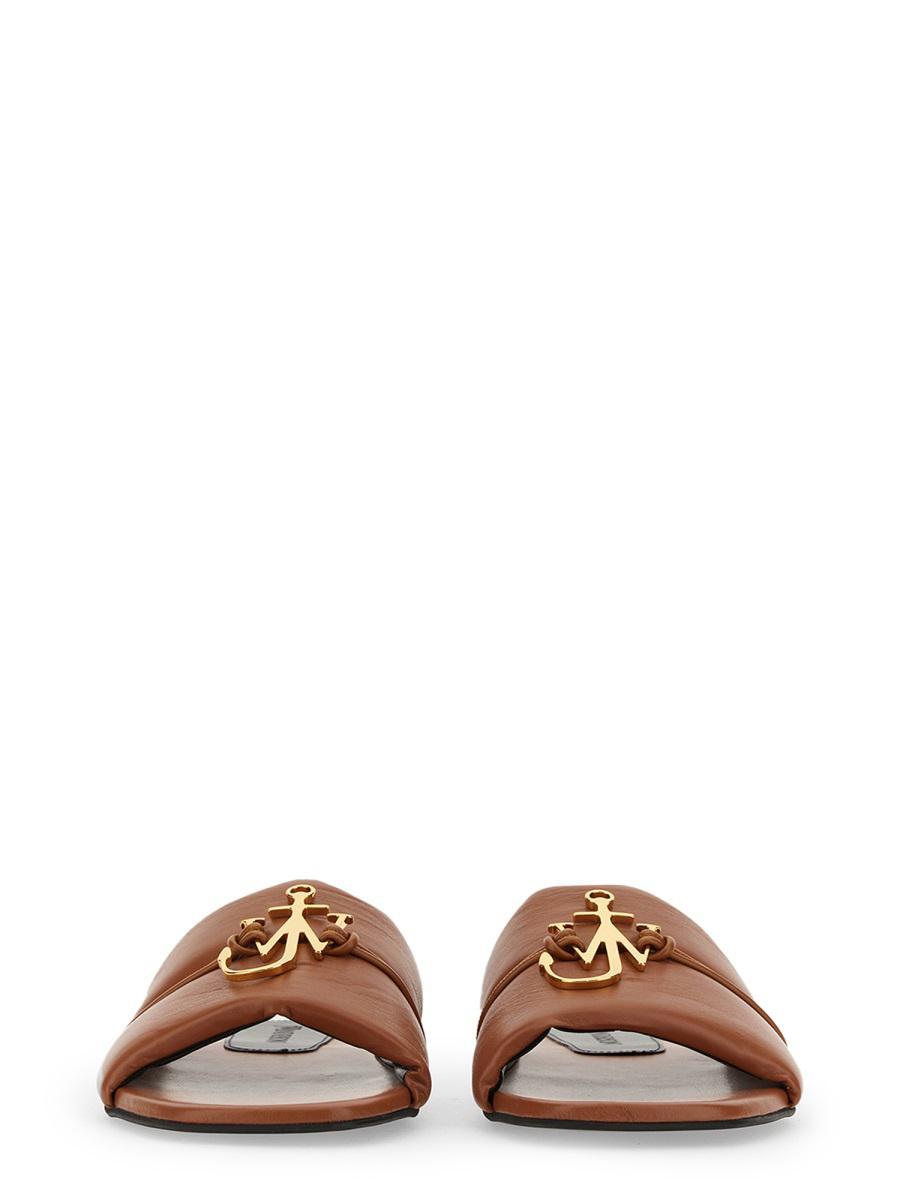 Jw Anderson Embellished Open Toe Flat Sole Mules In Brown