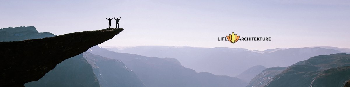 two hikers at the edge of mountain celebrating their perseverance sunset background