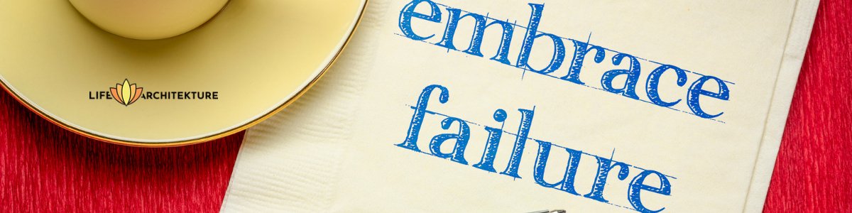 embrace failure written on a napkin next to a cup