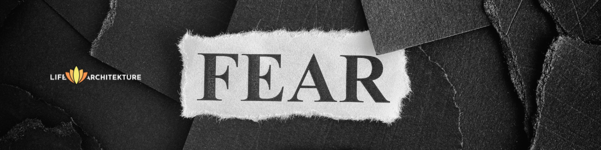 piece of white paper cut saying fear in capital letters