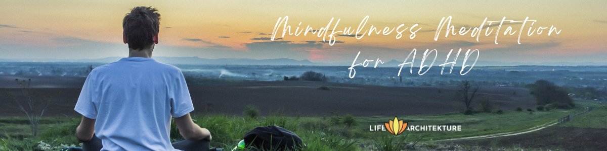 man meditation overlooking a green valley at sunset