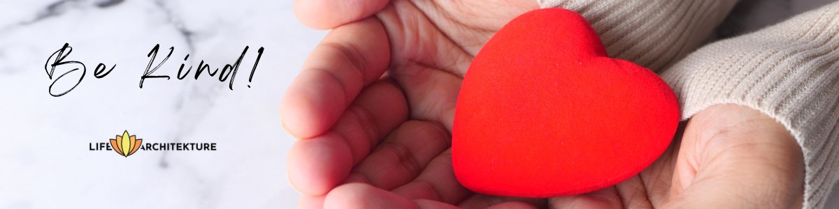 hands holding a small red pillow heart