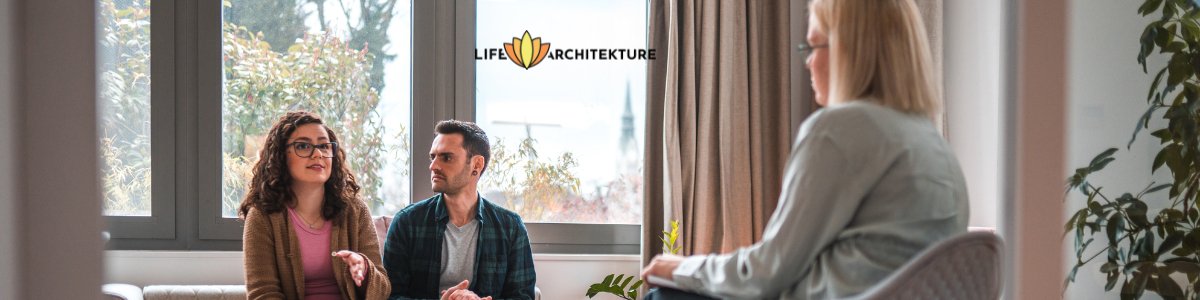 couple sitting by a window at a therapy discussing with woman therapist