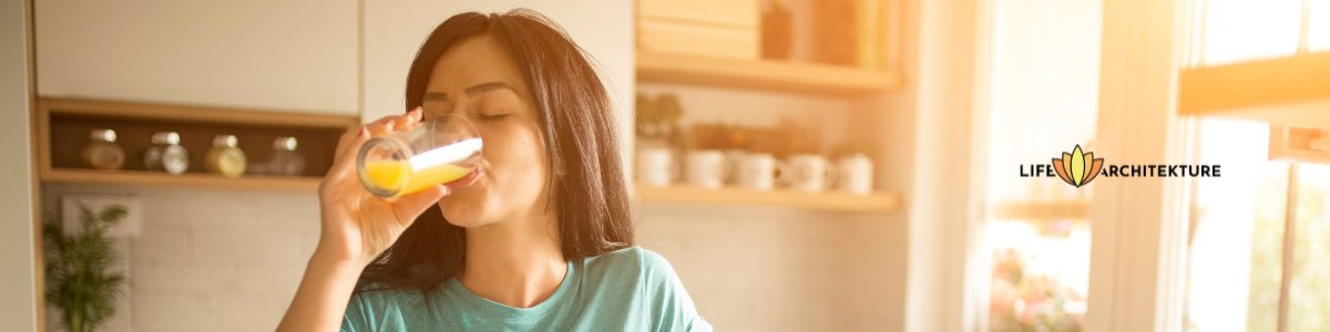 woman drinking juice eyes closed in the morning