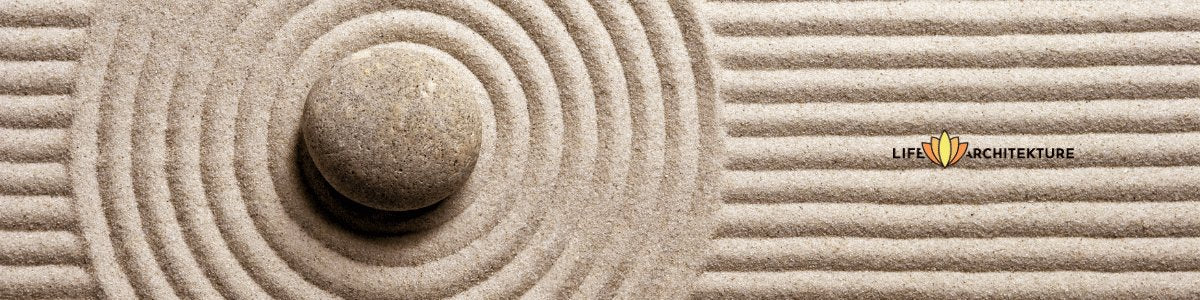 round rock on top of zen garden sand