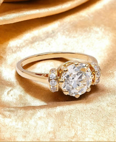 Round mine cut diamond engagement ring