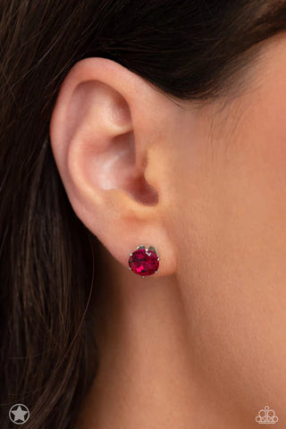 Image of Just in Timeless Pink, a single pink rhinestone stud earring on a post back.