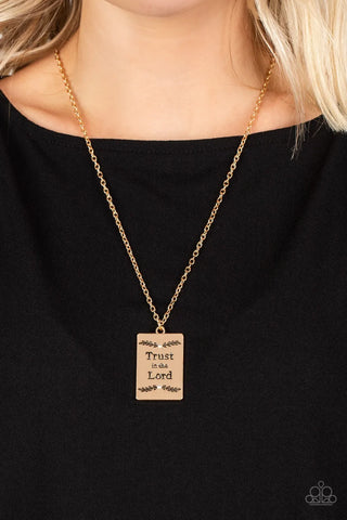 Image of "All About Trust - Gold" necklace.  A rectangular pendant inscribed with the phrase "Trust in the Lord."