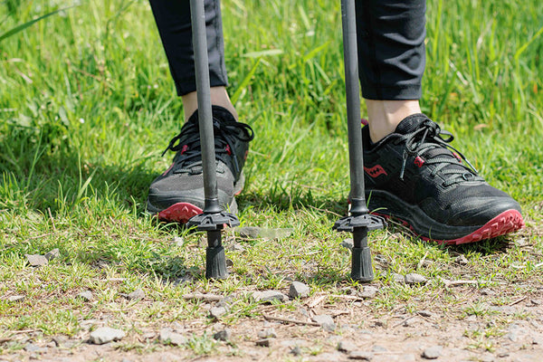 Trekking poles with rubber tips and mud baskets on tips