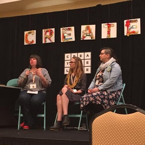 Self Care Panel with Meighan O'Toole, Lisa Anderson Shaffer, and Rosalie Gale sitting on a stage