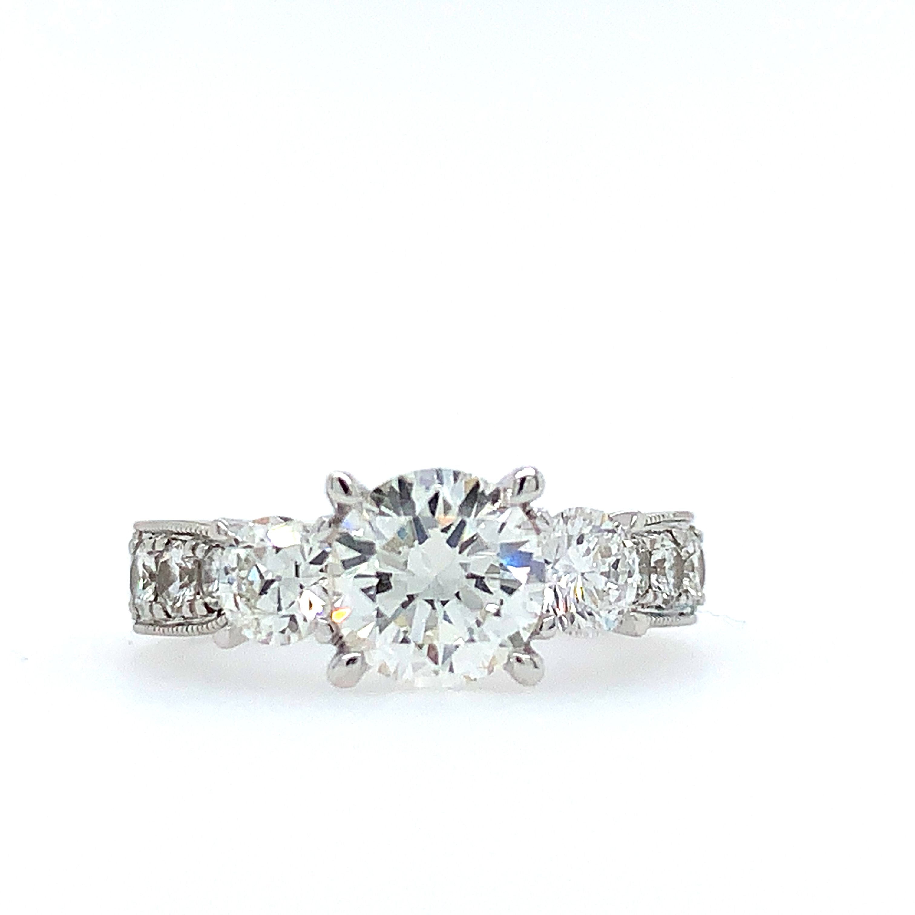 Three-Stone Ring with Round Diamond Center