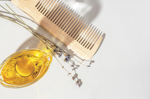hair oil with comb on table