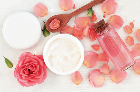 Rose petals, spoon, cream for natural face pack