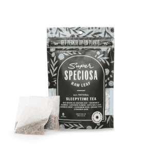 Packaging of Super Speciosa Sleepytime Tea with tea bags placed in front.