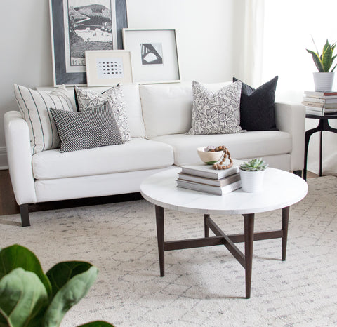 White sofa with black and white throw pillows