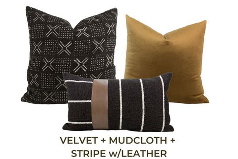 Three throw pillows in black and brown shades