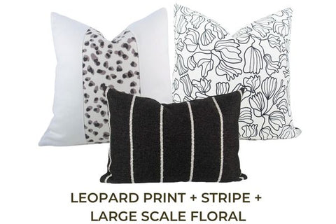 Three black and white pillows