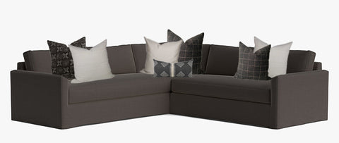 Grey sectional sofa with throw pillows