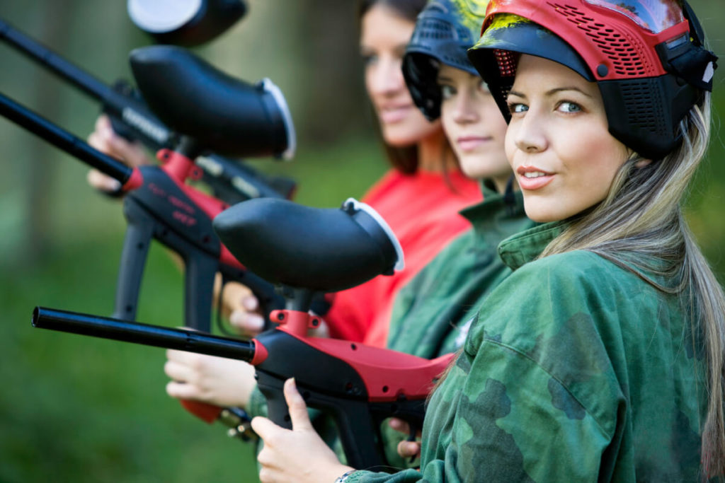 Girls in queue waiting to start playing paintball.