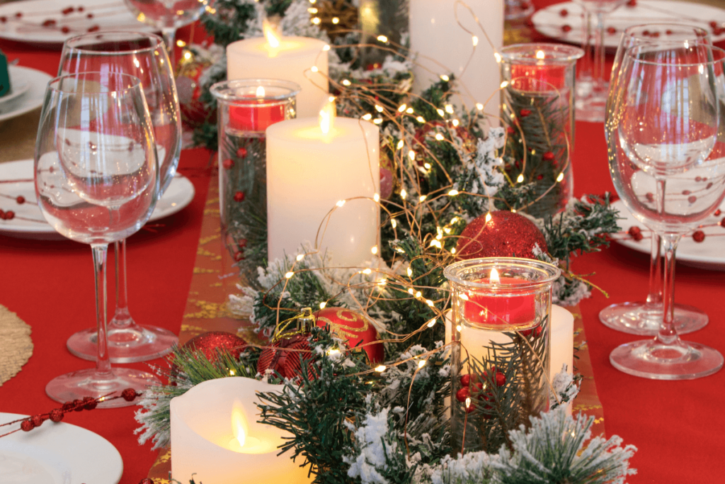 Christmas table decoration with white candles.