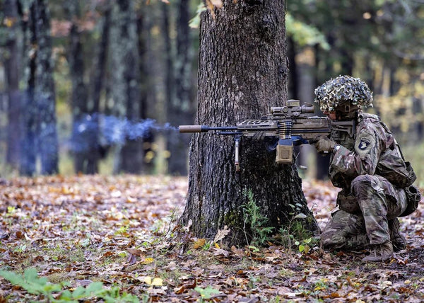 Soldier from 101st Airborne Division tests firing squad automatic weapon