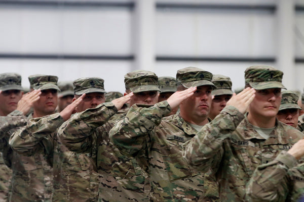 Active Duty U.S. Army Soldiers Saluting in Line