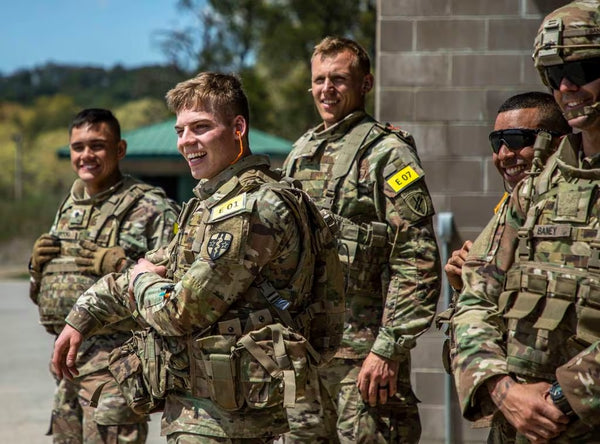 Army Reserve watching other soldiers fire during Best Squad Competition