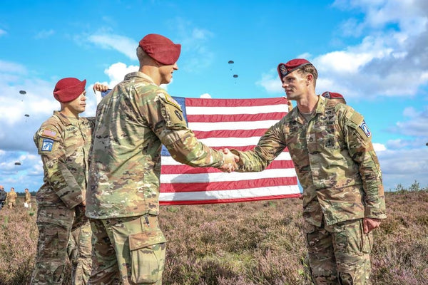 Enlisted soldiers shaking hands
