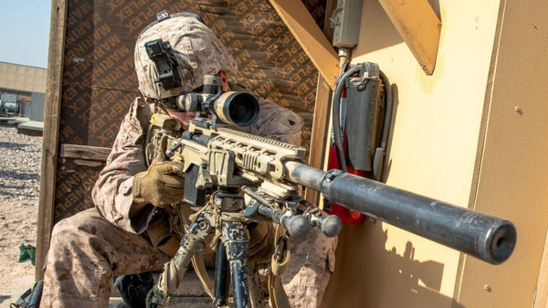 Sniper looking through scope