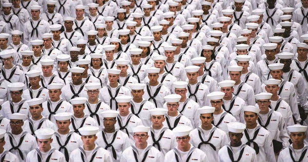 US Navy Recruiters stand in Formation