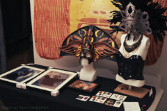 Display table with masks and photos