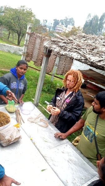 kane at a table teaching people how to prepare biodynamic prep