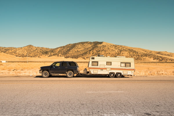 Small SUV towing a travel trailer