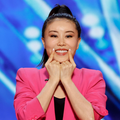Koko Hayashi performing her face yoga routine during her audition on America's Got Talent, demonstrating anti-aging exercises to the judges.